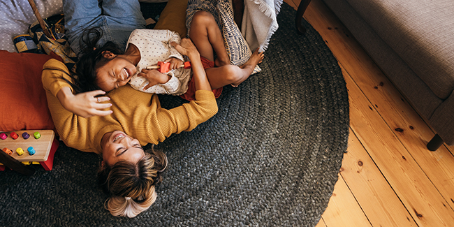 Mom and daughter laughing together