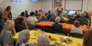 Members of the Argentine Mininite Church gather for a commissioning service as they bestow their church building to Youthfront.
