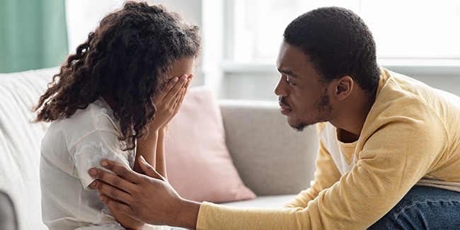 Father comforting his upset daughter