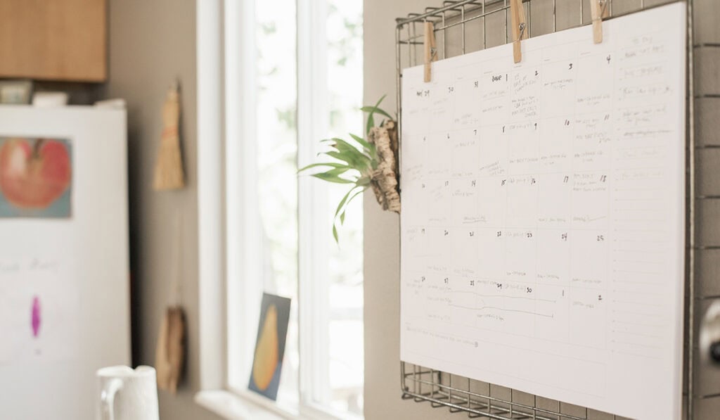 calendar hanging on kitchen wall