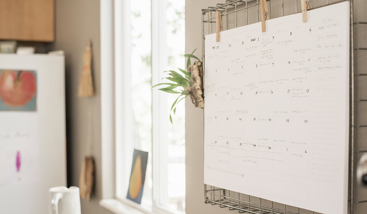 calendar hanging on kitchen wall