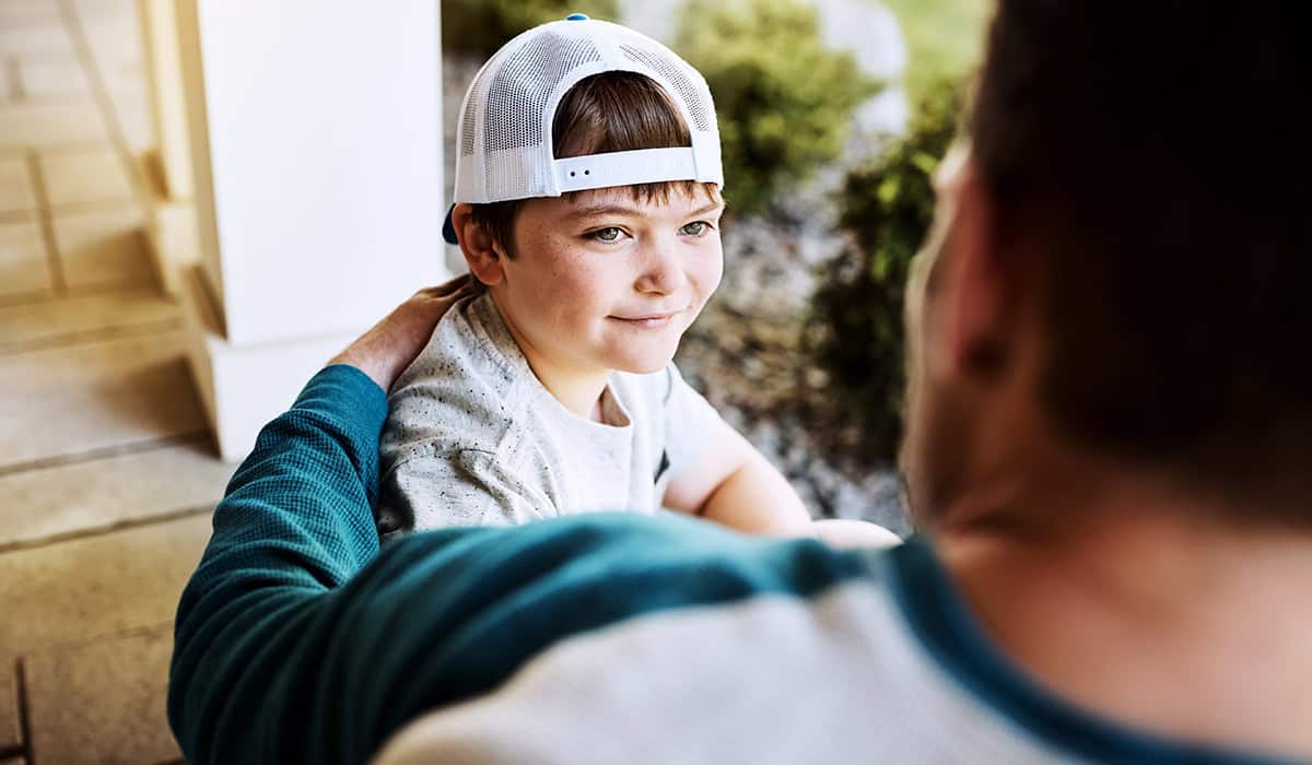 Son looking up at his dad